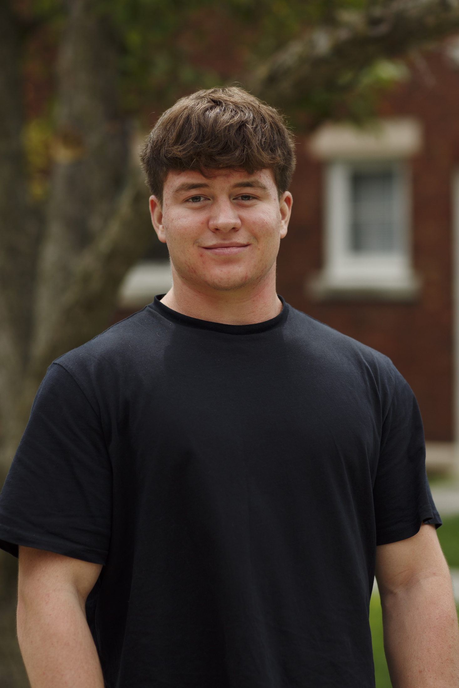 headshot of staff member Austin Woolston